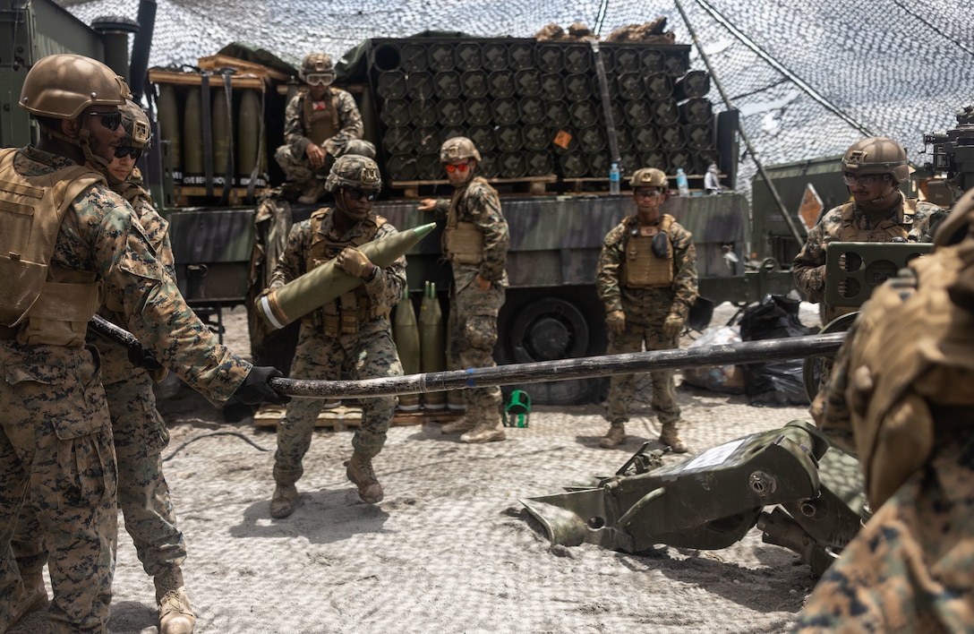 U.S. Marines with 3d Littoral Combat Team, 3d Marine Littoral Regiment, 3d Marine Division demonstrate loading an M777 155mm Howitzer alongside Philippine Marines and soldiers during Balikatan 23 in Santa Juliana, Philippines, April 13, 2023. Balikatan 23 is the 38th iteration of the annual bilateral exercise between the Armed Forces of the Philippines and the U.S. military. The exercise includes three weeks of training focused on amphibious operations, command and control, humanitarian assistance, urban operations and counterterrorism skills throughout northern and western Luzon. Coastal defense training figures prominently in the Balikatan 23 training schedule.