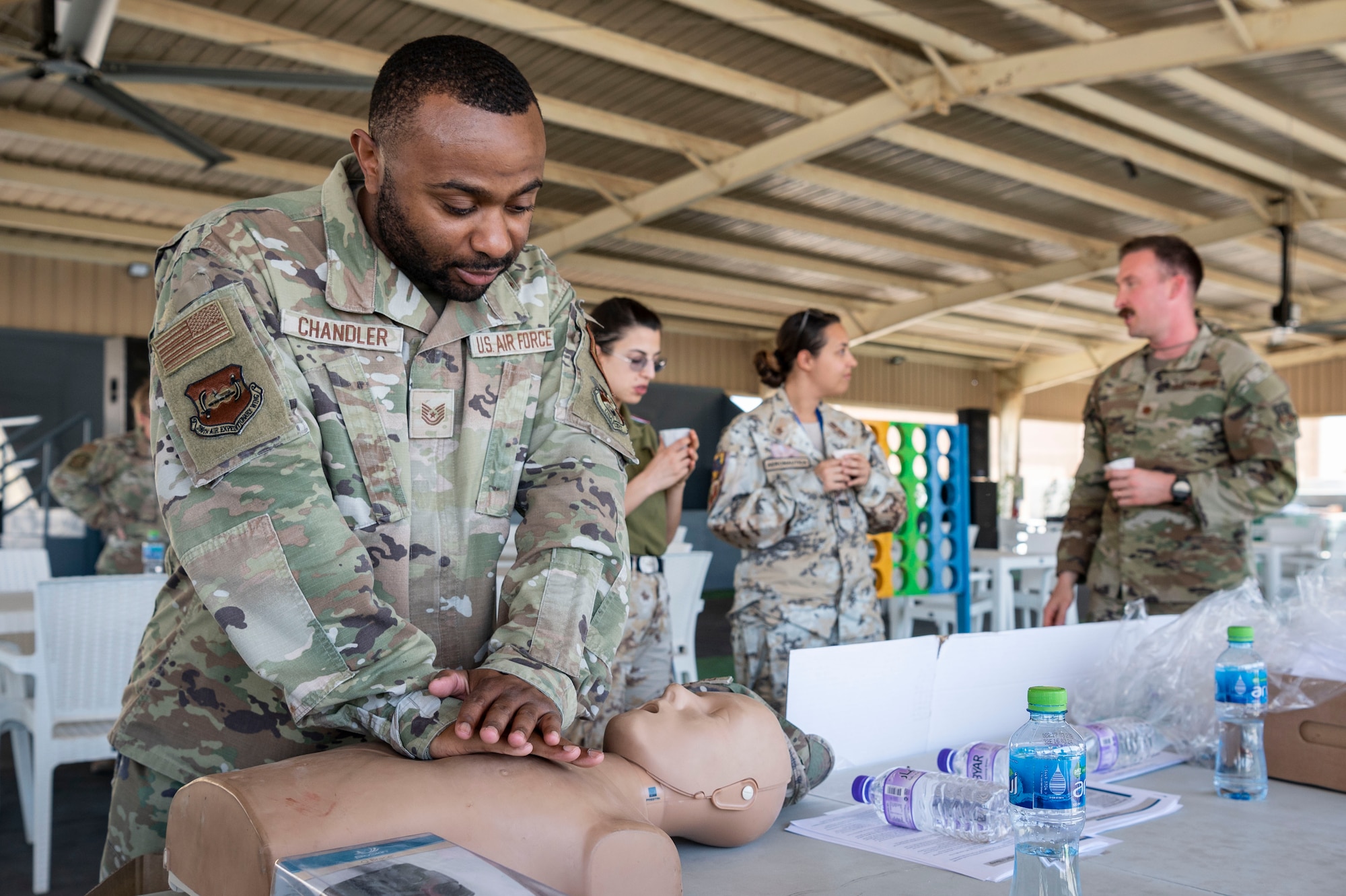U.S. Air Force Tech. Sgt. Rodrick Chandler, the 386th Air Expeditionary Wing equal opportunity specialist, practices chest compressions during a health fair at Ali Al Salem Air Base, Kuwait, April 27, 2023.