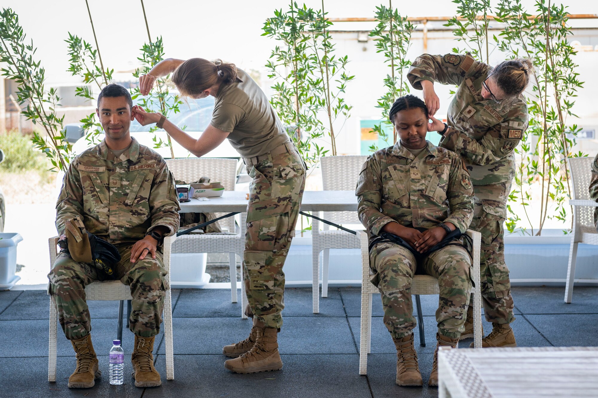 Marauders receive a battlefield acupuncture treatment during a health fair at Ali Al Salem Air Base, Kuwait, April 27, 2023.