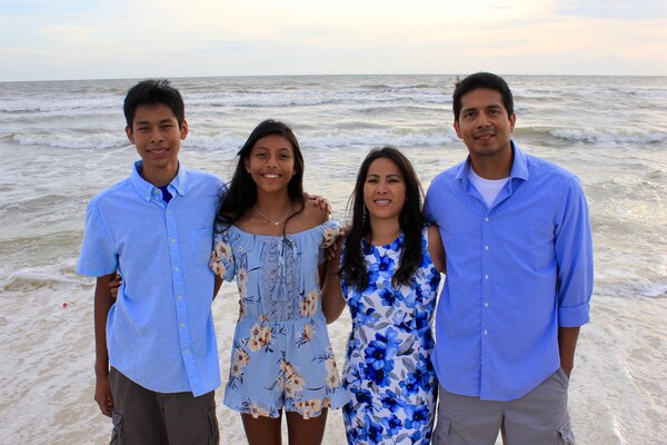 During a vacation to Florida, Phanna Cea (second from right) and her husband, Cesar Cea (right) along with their son and daughter on the beach March 30, 2023.