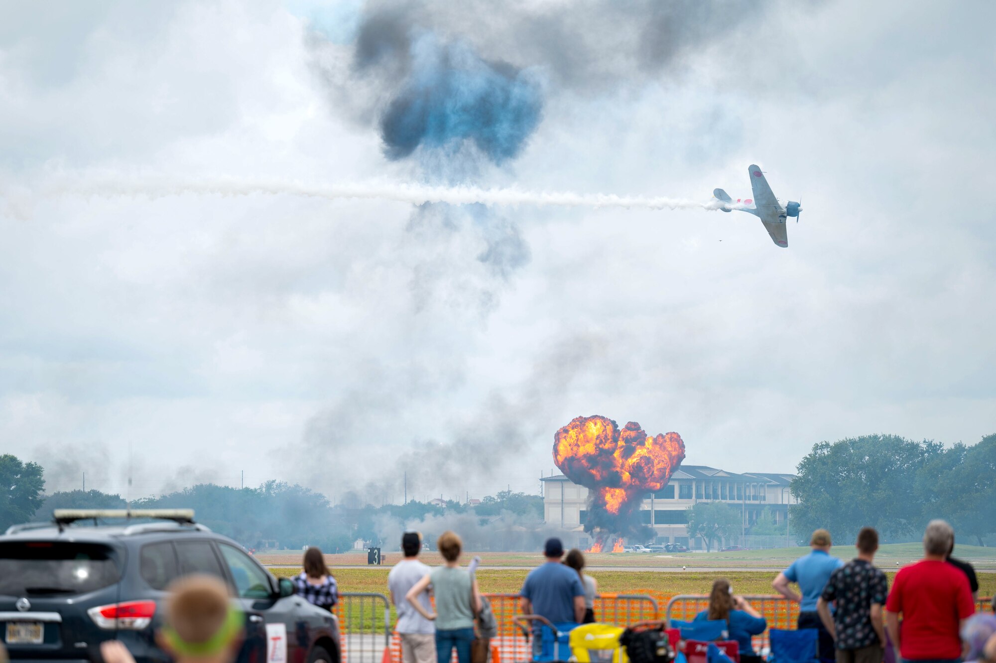Aircraft from Commemorative Air Force perform a World War II bombing reenactment with live explosives during the 2023 Thunder Over the Sound Air and Space Show at Keesler Air Force Base, Mississippi, April 29, 2023.