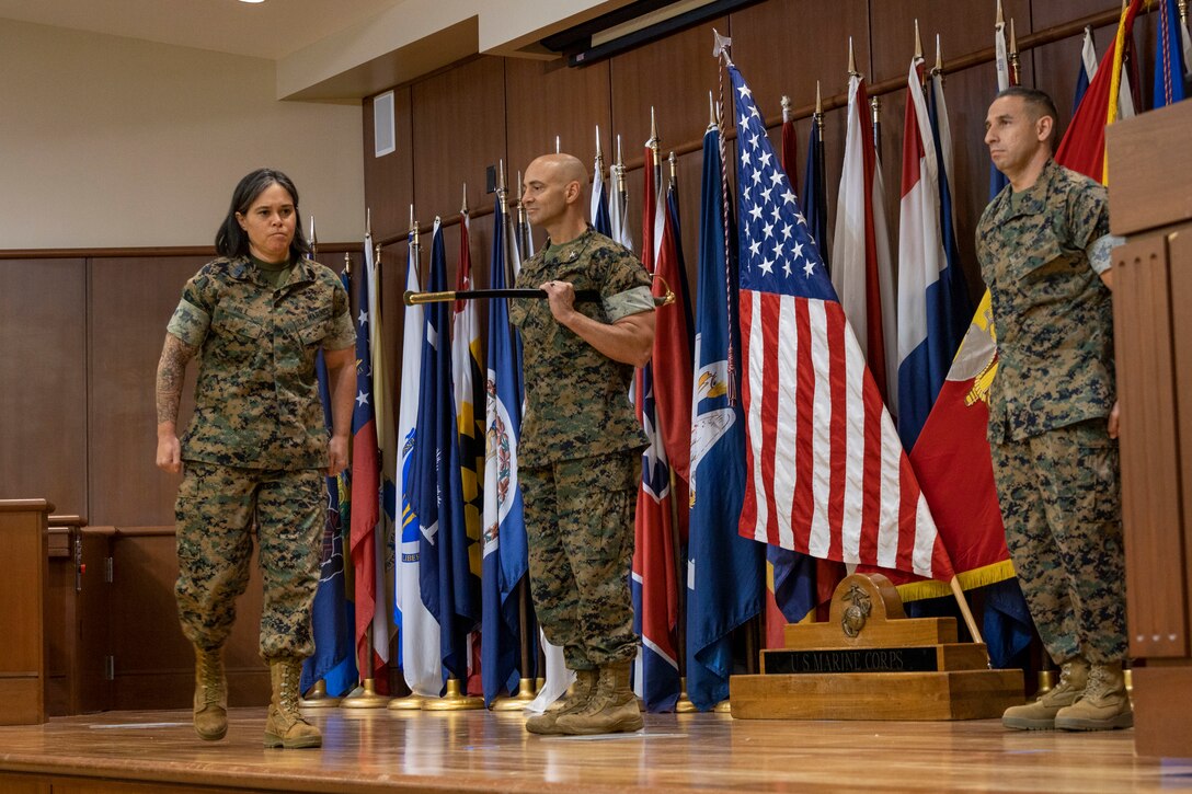 U.S. Marine Corps Col. Jason Burkett, commanding officer of Headquarters Battalion, Marine Forces Reserve and commanding officer of Marine Corps Support Facility New Orleans, starts the sergeant major relief and appointment ceremony with Master Gunnery Sgt. Felipe Lopez, outgoing sergeant major for Headquarters battalion Marine Forces Reserve, Marine Forces South, conducts a passing of the sword with Sgt. Maj. Michelle Hill, incoming sergeant major for Headquarters battalion Marine Forces Reserve, Marine Forces South, at Marine Corps Support Facility New Orleans, April 21, 2023. The ceremony exemplifies customs and tradition by showcasing the transfer of leadership between the outgoing and incoming sergeants major. (U.S. Marine Corps photo by Lance Cpl. Mitchell Collyer)