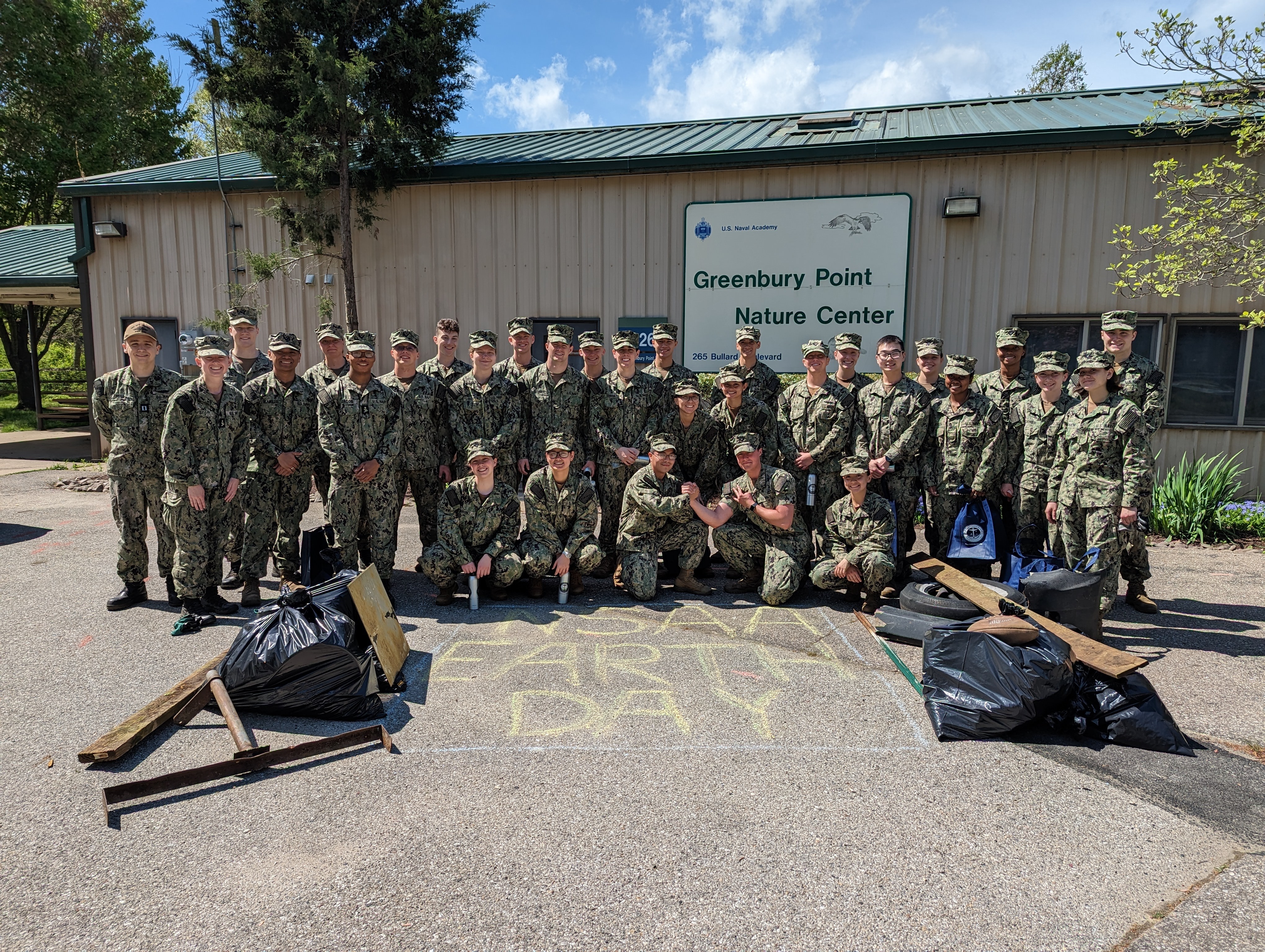 Midshipman from the U.S. Naval Academy participated in an environmental cleanup at Greenbury Point in commemoration of Earth Day.