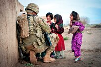 Sgt. Jason Smith, a paratrooper with the 82nd Airborne Division’s 1st Brigade Combat Team, talks with a group of Afghan children during an Afghan-led clearing operation April 28, 2012, Ghazni province, Afghanistan. Smith serves with 2nd Battalion, 504th Parachute Infantry Regiment. (U.S. Army photo by Sgt. Michael J. MacLeod