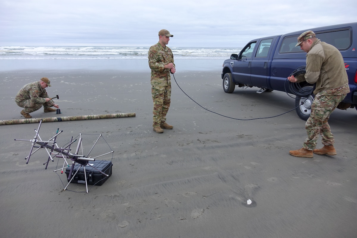 Setting up communication equipment on an Oregon beach