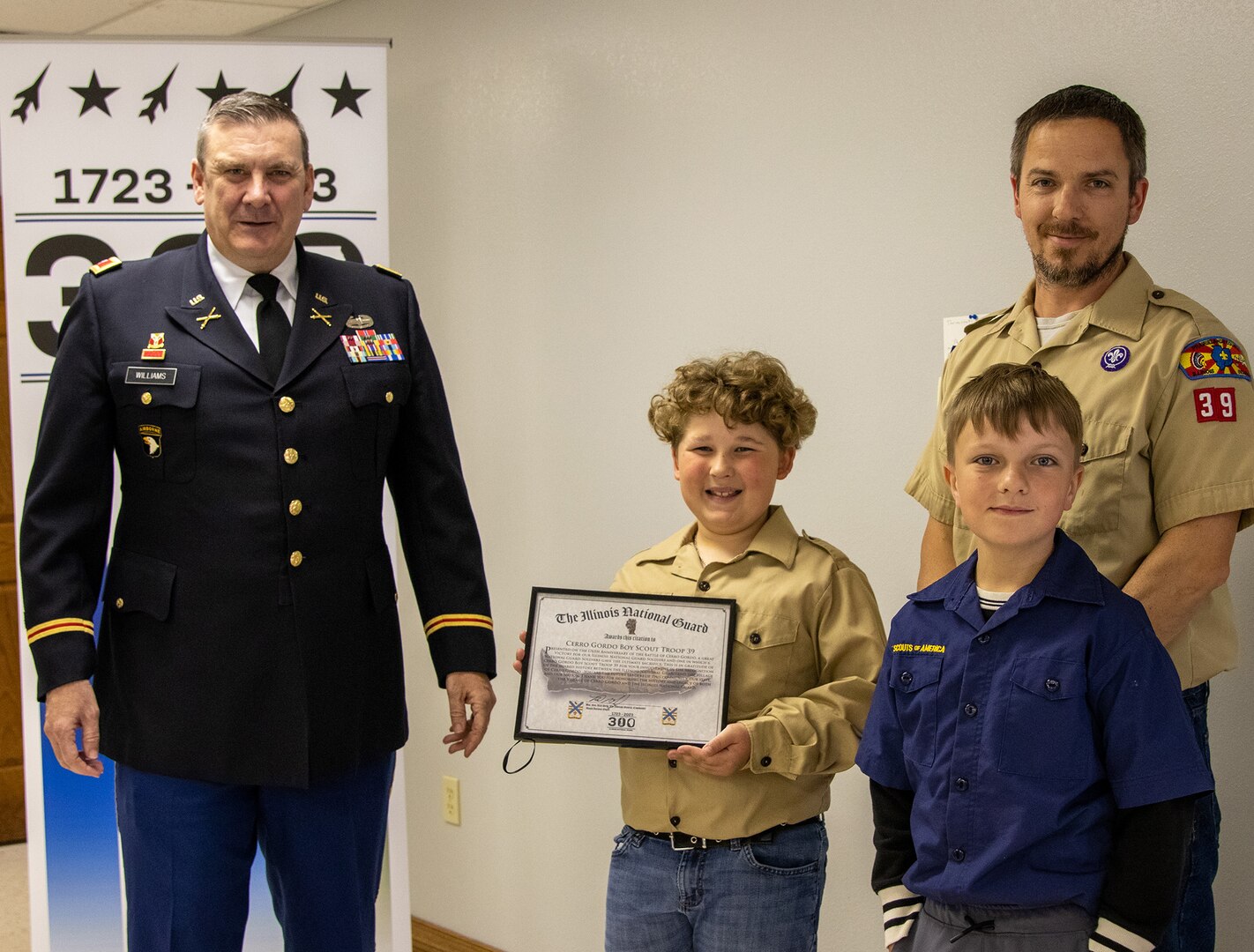 Col. Lenny Williams, Chief of Staff, Illinois Army National Guard, presents a certificate of appreciation to Cerro Gordo Boy Scout Troop 39 April 17, for their service to the Cerro Gordo, Illinois, community.