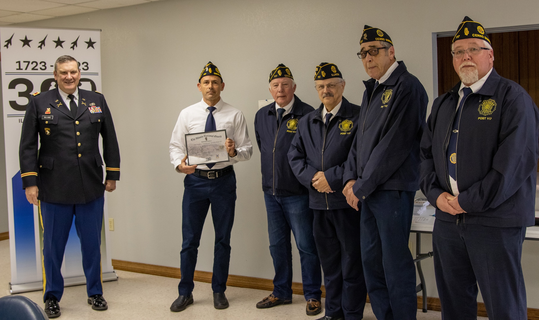 Col. Lenny Williams, Chief of Staff, Illinois Army National Guard, presents a certificate of appreciation to Cerro Gordo American Legion Post 117 April 17, for their service to the Cerro Gordo, Illinois, community.