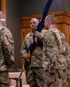 Command Sgt. Maj. Jonathan Genisio, of Orion, Illinois, receives the 129th Regiment (Regional Training Institute) regimental colors during the change of responsibility ceremony April 23 at the Illinois Military Academy, Camp Lincoln, Springfield, Illinois.