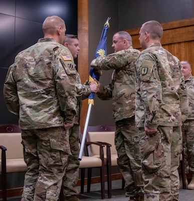 Command Sgt. Maj. Jonathan Genisio, of Orion, Illinois, receives the 129th Regiment (Regional Training Institute) regimental colors during the change of responsibility ceremony April 23 at the Illinois Military Academy, Camp Lincoln, Springfield, Illinois.