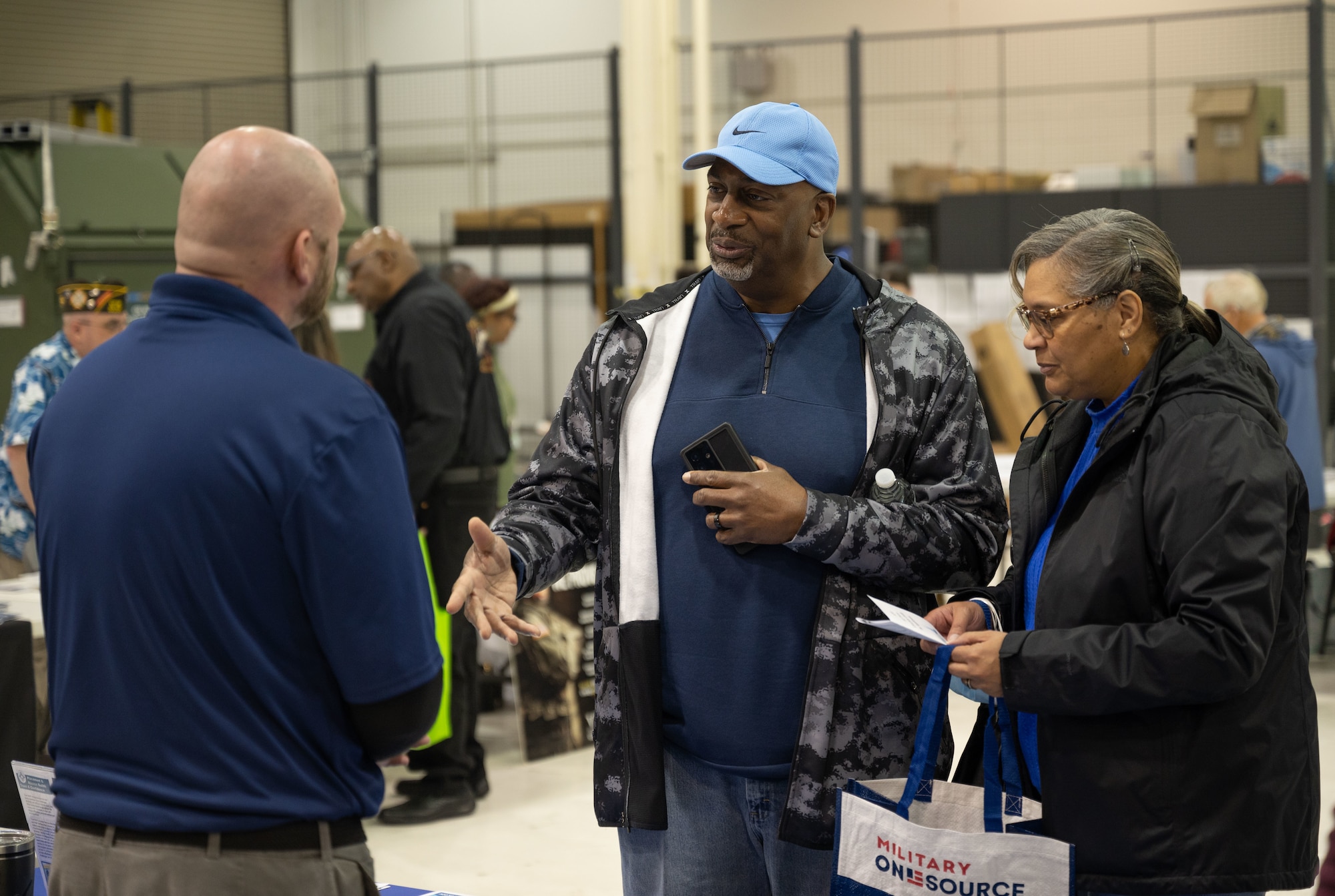 Gerald Spady, middle, retired Air National Guard member, and his wife, Colette, speak with Nicholas Kligmann, left, 436th Force Support Squadron human resources specialist, during the 2023 Retiree Appreciation Day event on Dover Air Force Base, Delaware, April 28, 2023. The event connected military retirees with helpful resources including the 436th Medical Group, Dover AFB Military and Family Readiness Center, 436th Airlift Wing Legal Office and Air Force Sergeants Association. (U.S. Air Force photo by Senior Airman Cydney Lee)