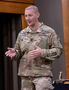 Illinois Army National Guard Command Sgt. Maj. Brandon Golden, of Easton, Illinois, thanks his family for their support throughout his career during a retirement ceremony April 23 at the Illinois Military Academy on Camp Lincoln, Springfield, Illinois.