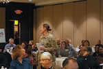 Col. Megan Stallings, USMEPCOM commander, engages with attendees at the 2023 Medical Leadership Training Symposium (MLTS).