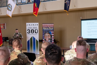 Illinois Army National Guard Maj. Matt Larson, 6th Battalion, 54th Security Forces Assistance Brigade, talks about his recent year-long deployment to the Philippines as part of Logistics Advisory Team 6611, during the Liberation of Baguio commemoration event at the Urbana Armory April 26.