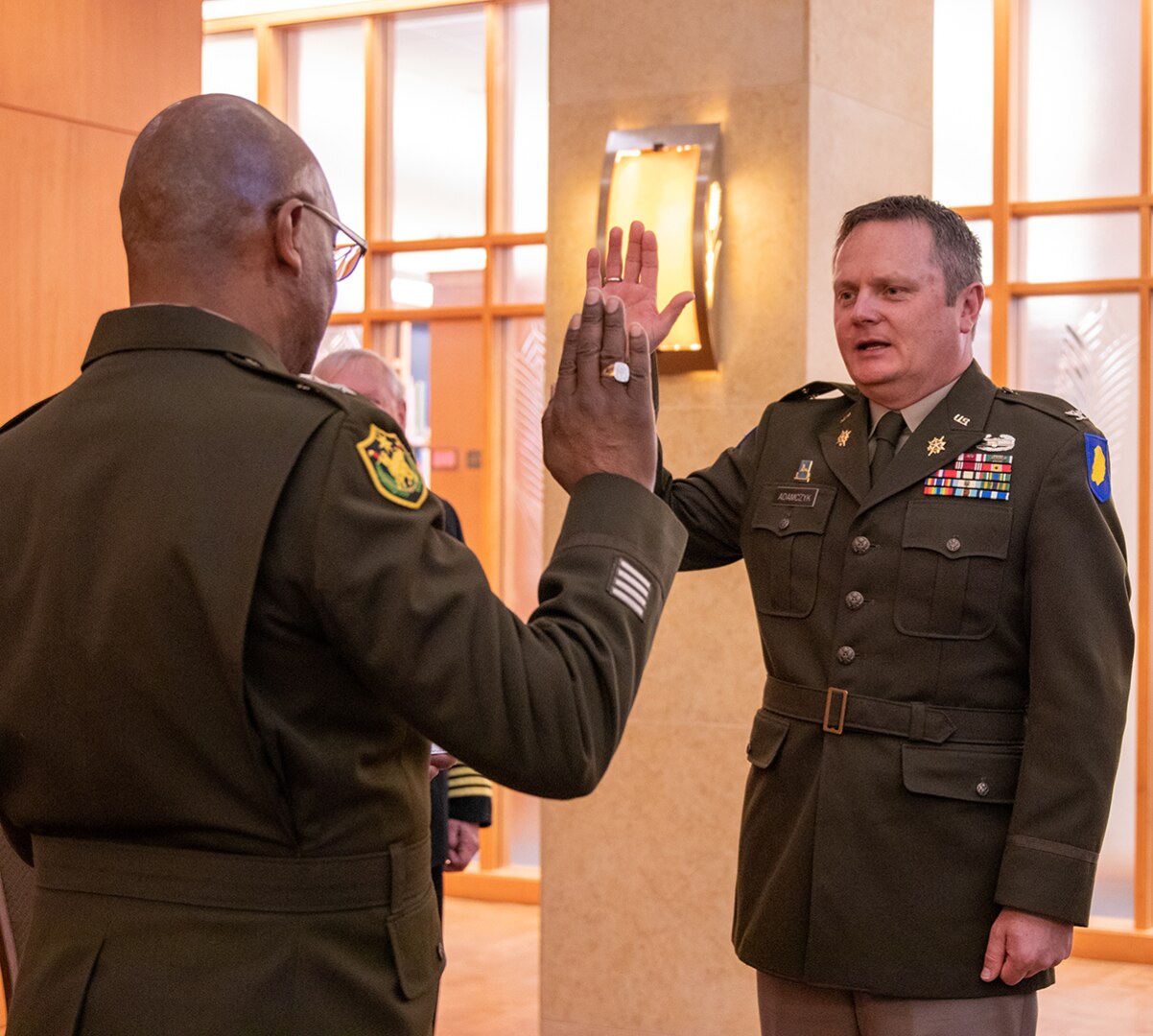 Maj. Gen. Rodney Boyd, Assistant Adjutant General – Army and Commander of the Illinois Army National Guard, administers the oath of commissioned officers to newly promoted Illinois Army National Guard Col. Andrew Adamczyk, of Springfield, during a promotion ceremony April 28 at the Abraham Lincoln Presidential Library and Museum in Springfield.