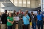 Members of Project Tuskegee pose for a photo during a Project Tuskegee, Aviation Inspiration Mentorship event at Travis Air Force Base, California, April 28, 2023. More than 400 students from the surrounding schools and universities attended an aviation-focused event with opportunities to learn from Airmen and discuss career prospects as well as tour a B-1B Lancer from Ellsworth AFB and a C-5M, C-17 Globemaster III and KC-10 from Travis AFB. (U.S. Air Force photo by Nicholas Pilch)