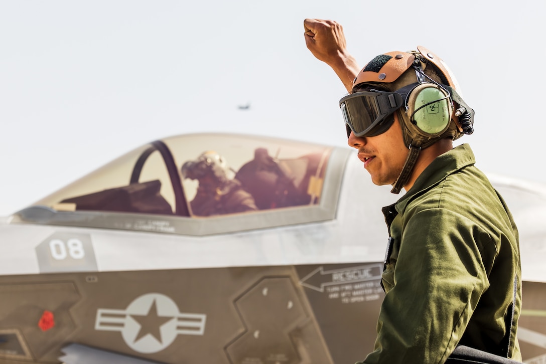 U.S. Marine Corps Lance Cpl. Isaiah Maez, a fixed-wing aircraft mechanic with Marine Fighter Attack Squadron 242, Marine Aircraft Group 12, Japan, signals to an F-35B Lightning II aircraft during the Fiscal Year 2023 Korea Flying Training at Gwangju Air Base, Republic of Korea, April 13, 2023. KFT 23 is a combined training event focused on tactical execution of combat missions and is part of the ROK-U.S. alliance's routine, annual training program.