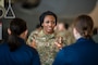 A U.S. Air Force Capt. Smith speaks with others at a Project Tuskegee, Aviation Inspiration Mentorship event to high school Junior Reserve Officers' Training Corps cadets at Travis Air Force Base, California, April 28, 2023. (U.S. Air Force photo by Nicholas Pilch)