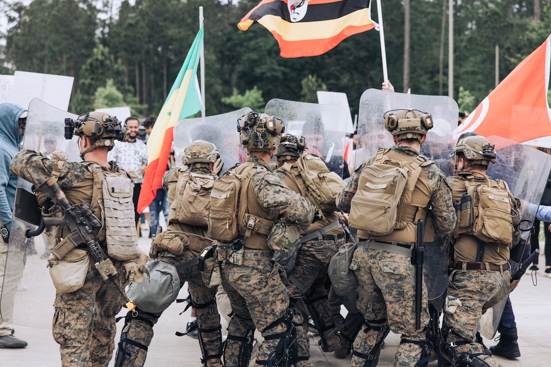 U.S. Marines with the 26th Marine Expeditionary Unit utilize crowd control techniques during a Noncombatant Evacuation Operation as part of Amphibious Ready Group/MEU Exercise at Stone Bay, North Carolina, April 25, 2023. NEOs assist the U.S. Department of State with the evacuation of citizens and approved personnel from a foreign nation to an appropriate safe haven. The 26th Marine Expeditionary Unit is underway with the Bataan ARG conducting ARGMEUEX.