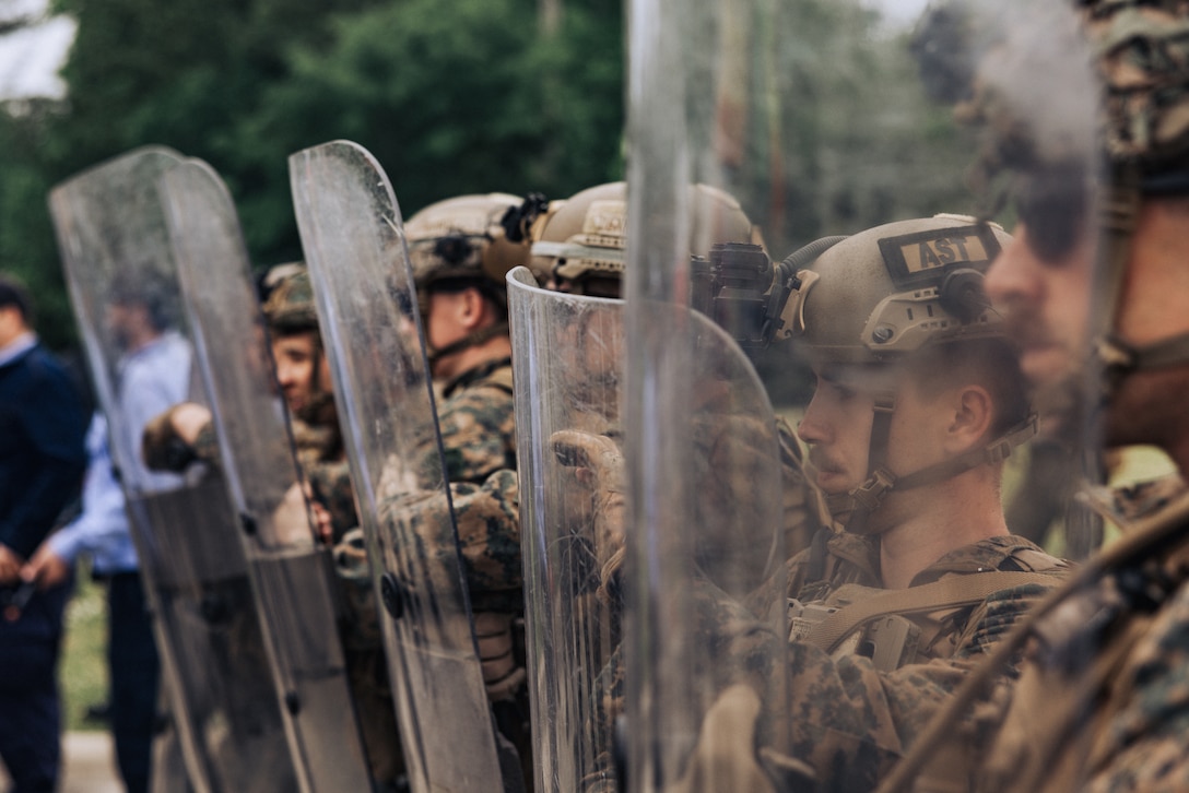 U.S. Marines with the 26th Marine Expeditionary Unit utilize crowd control techniques during a Noncombatant Evacuation Operation as part of Amphibious Ready Group/MEU Exercise at Stone Bay, North Carolina, April 25, 2023. NEOs assist the U.S. Department of State with the evacuation of citizens and approved personnel from a foreign nation to an appropriate safe haven. The 26th Marine Expeditionary Unit is underway with the Bataan ARG conducting ARGMEUEX.