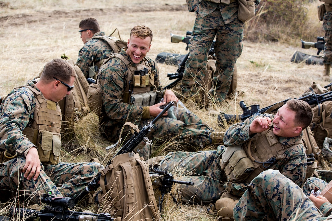 U.S. Marines with Fleet Anti-terrorism Security Team Europe laugh during down-time, after completing an M240B machine gun range during Exercise Platinum Lynx. Multiple nations from across Eastern Europe, and the U.S., participated in the exercise designed to enhance warfighting capabilities and build relationships from an international level, all the way down to a platoon level.
