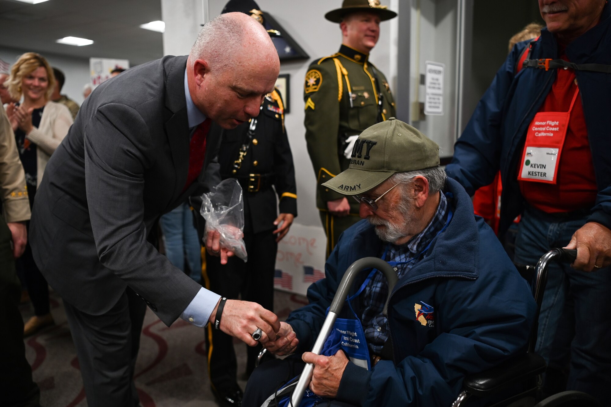Dan Dow, San Luis Obispo County district attorney, greets veterans during their arrival to the Santa Maria Airport in Santa Maria, Calif., April 26, 2023. Over 1,000 attendees showed support at the event including family members, friends, military personnel and local residents. (U.S. Space Force photo by Senior Airman Tiarra Sibley)