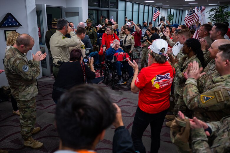WWII, Korea and Vietnam war veterans of the California Central Coast Coastal Honor Flight are cheered on by attendees as they arrive at the Santa Maria Airport in Santa Maria, Calif., April 26, 2023. More than 1,000 attendees showed up to support the event including family members, friends, military personnel and local residents. (U.S. Space Force photo by Tech. Sgt. Luke Kitterman)