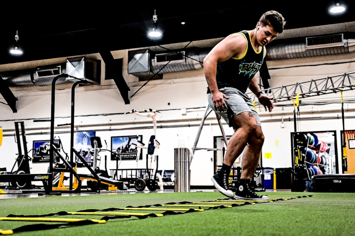 Senior Airman Austin Sondergard, 605th Aircraft Maintenance Squadron crew chief, exercises at the Griffith Field House at Joint Base McGuire-Dix-Lakehurst, N.J. Oct. 10, 2022.