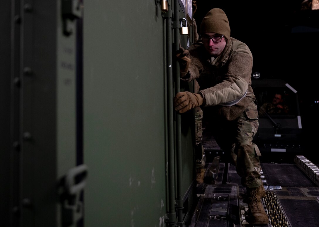 U.S. Air Force Senior Airman Chance Harrison, 28th Logistic Readiness Squadron  fuels distribution operator, loads cargo onto a C-17 Globemaster III at Ellsworth Air Force Base, South Dakota during a partner integration mission in support of Exercise COPE INDIA 23, April 6, 2023. Through exercises and engagements, the U.S. improves its ability to work together with allies and partners to build their collective strength. (U.S. Air Force Photo by Airman 1st Class Yendi Borjas)