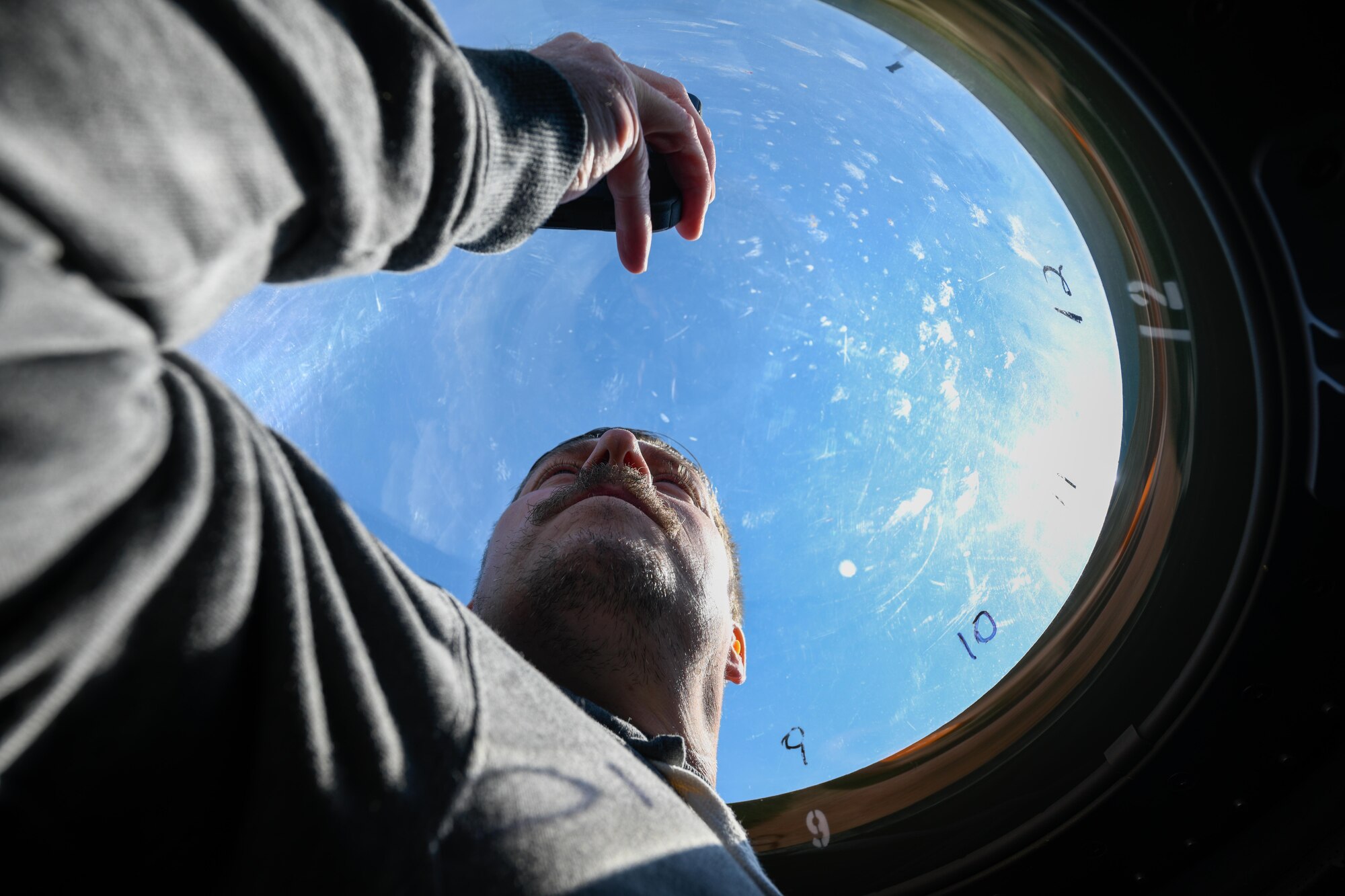 Robert Bauman, the assistant principal of Newton Falls High School, takes a selfie in the observation bubble of a C-130H Hercules aircraft assigned to the 910th Airlift Wing while circling above Niagara Falls, April 27, 2023.