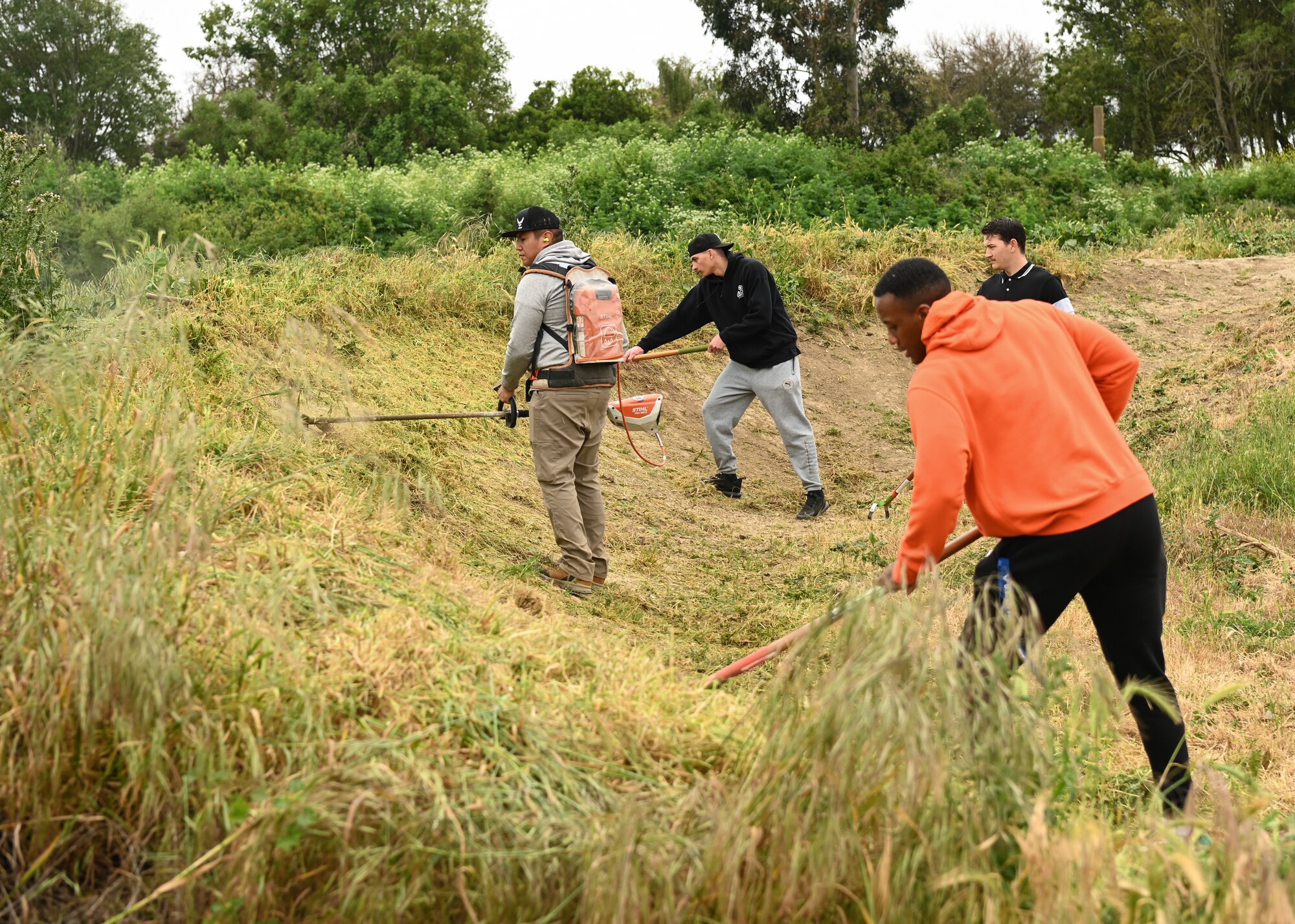 Members of Vandenberg's 30th Civil Engineer Squadron volunteers at the River Bend Bike Park in Lompoc, Calif., April 28, 2023. The members raked and pulled all unwanted weeds and rocks to help beautify the park. (U.S. Space Force photo by Senior Airman Tiarra Sibley)