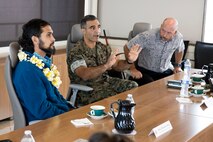 U.S. Marine Corps Col. Speros Koumparakis, center, commanding officer, Marine Corps Base Hawaii, briefs Sen. Brenton Awa with Hawaii State Senate District 23 and staff during a visit to the installation, Kansas Tower, MCBH, April 27, 2023. The purpose of the visit was to discuss MCBH water consumption and the public partners program. (U.S. Marine Corps photo by Sgt. Julian Elliott-Drouin)