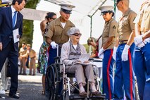 U.S. Marines with Headquarters and Service Battalion, Marine Corps Forces, Pacific, escort Margaret Turner, an Australian veteran who served in the Women’s Auxiliary Australian Air Force during World War II, to her seat during a commemorative service in honor of Australian and New Zealand Army Corps Day at the National Memorial Cemetery of the Pacific, Honolulu, Hawaii, April 25, 2023. The service was held to commemorate the first major military action fought by Australian and New Zealand forces during World War I, and to recognize the sacrifices and service of the Anzac forces. Anzac Day has been observed annually in Honolulu since 1973. (U.S. Marine Corps photo by Cpl. Brandon Aultman)