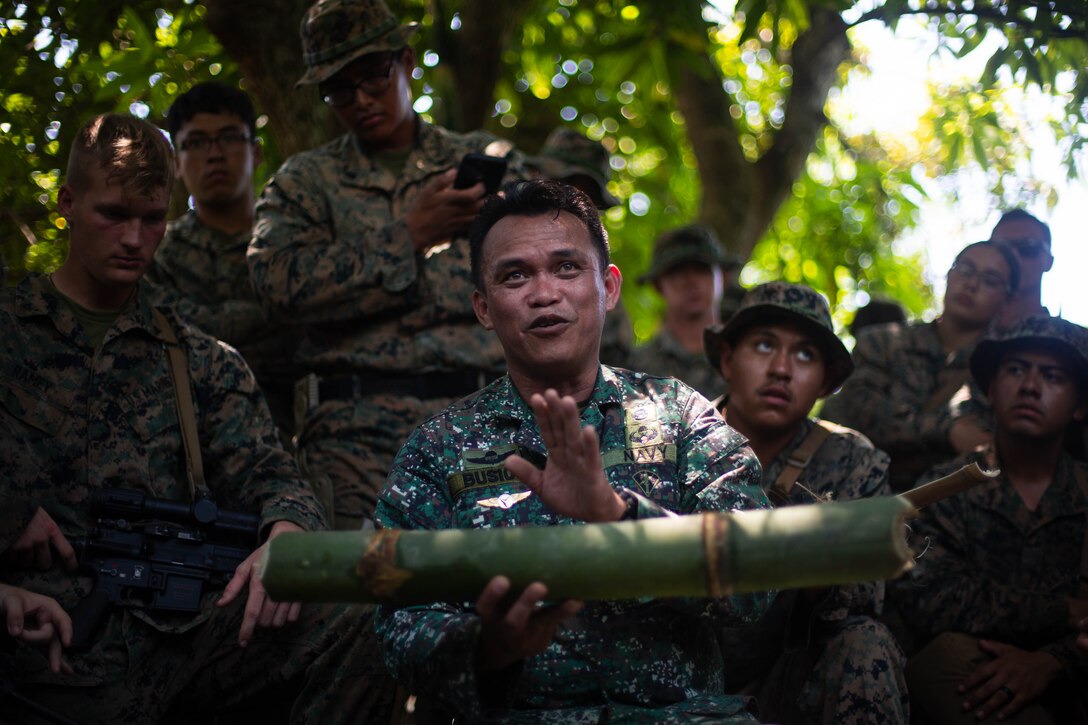 A Philippine Marine, with Force Reconnaissance Group, Small Unmanned Aircraft System Team 1, instructs a bilateral jungle survival class with U.S. Marines, with 3d Littoral Combat Team, 3d Marine Littoral Regiment, 3d Marine Division, during Balikatan 23 at Cagayan Airfield, Philippines, April 19, 2023. Balikatan 23 is the 38th iteration of the annual bilateral exercise between the Armed Forces of the Philippines and the U.S. military. The exercise includes three weeks of training focused on amphibious operations, command and control, humanitarian assistance, urban operations and counterterrorism skills throughout northern and western Luzon. Coastal defense training figures prominently in the Balikatan 23 training schedule. (U.S. Marine Corps photo by Cpl. Eric Huynh)