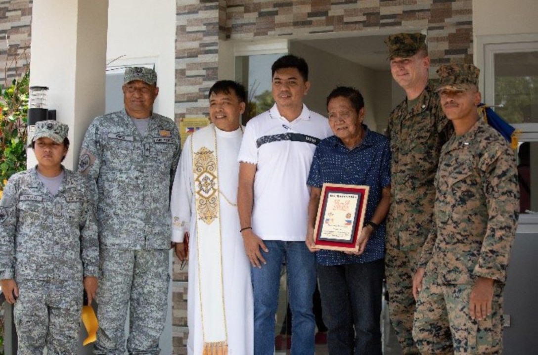 U.S. Marines with 9th Engineer Support Battalion, Philippine Air Force members of the 355th Aviation Support Wing and members of the Baler community, pose for a photo after a ribbon cutting ceremony for the opening of a health care clinic during Balikatan 23, Baler, Aurora, Philippines, April 26, 2023. (U.S. Marine Corps photo by Lance Cpl. Sebastian Riveraaponte)