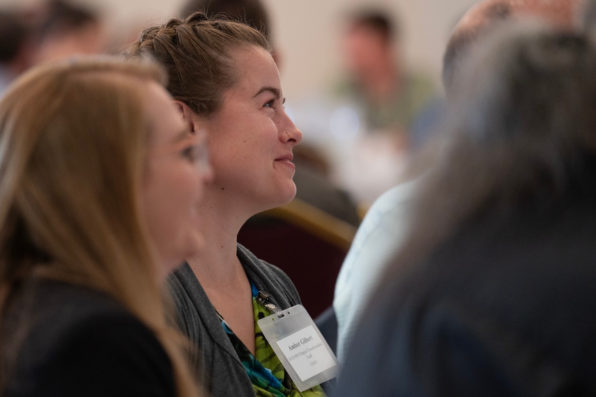 Woman listens to a presentation at a digital engineering workshop