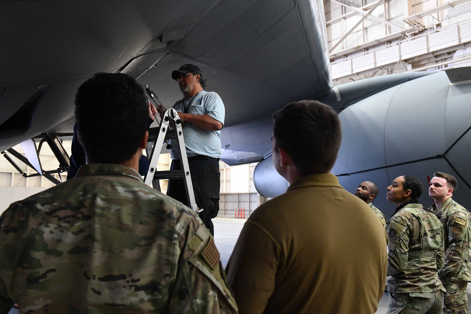 Sean Robinson, 97th Aircraft Maintenance Squadron work leader, demonstrates how to remove a stuck screw from a KC-46 Pegasus panel at Altus Air Force Base (AFB), Oklahoma, April 18, 2023. The KC-46 is a tanker aircraft and is the newest addition to Altus AFB’s fleet. (U.S. Air Force photo by Airman 1st Class Miyah Gray)