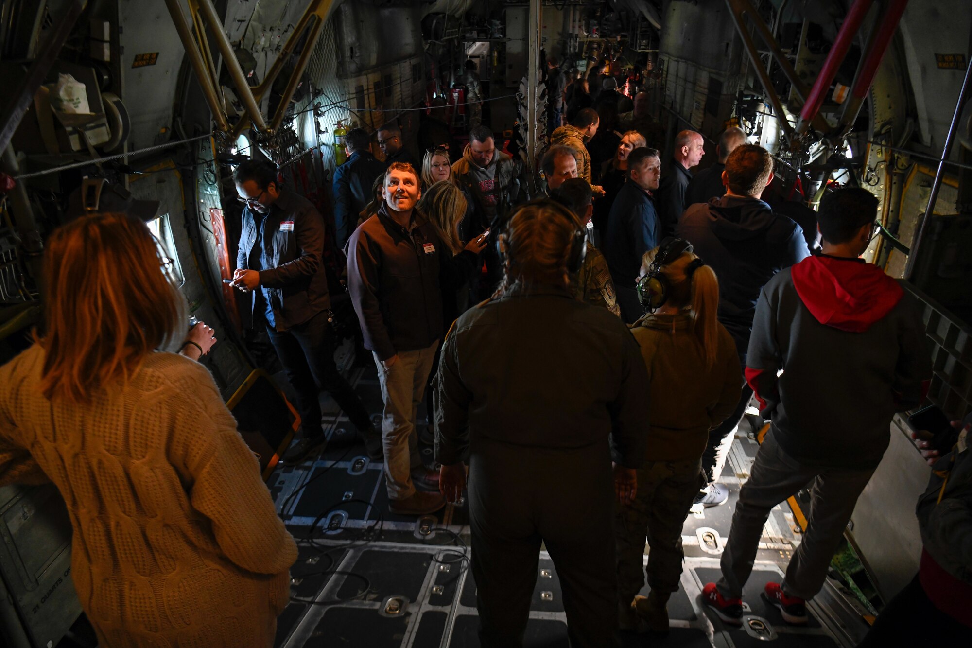 Local educators from the Youngstown Air Reserve Station recruitment area walk around a C-130H Hercules aircraft assigned to the 910th Airlift Wing en route to Niagara Falls, April 27, 2023.