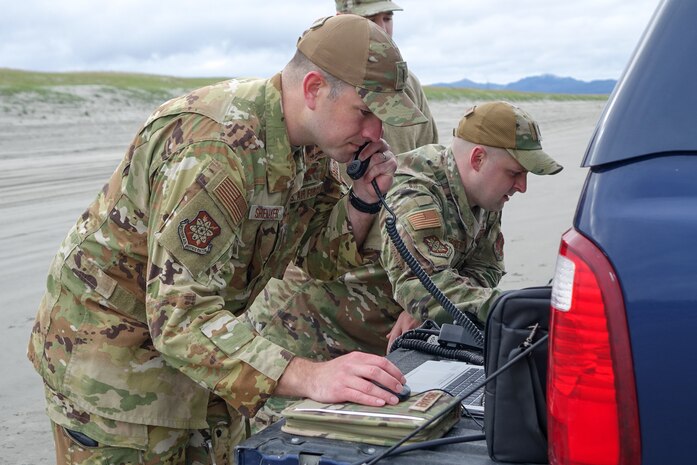 Setting up communication equipment on an Oregon beach