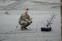 Setting up communication equipment on an Oregon beach