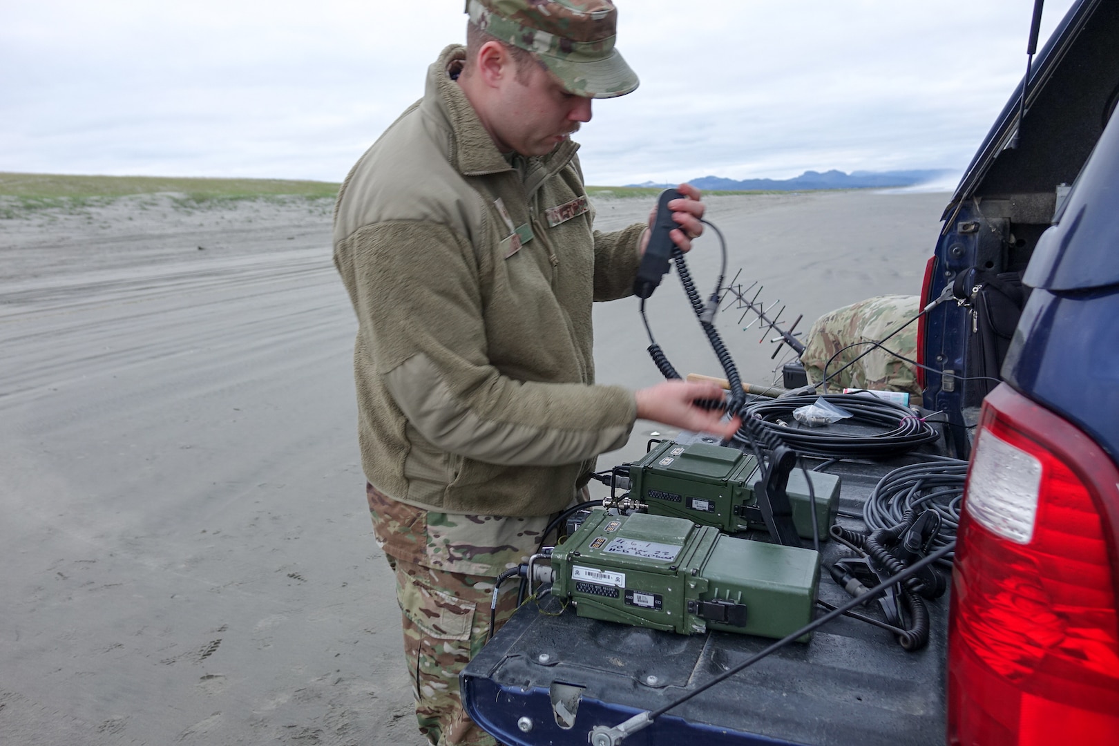 Setting up communication equipment on an Oregon beach