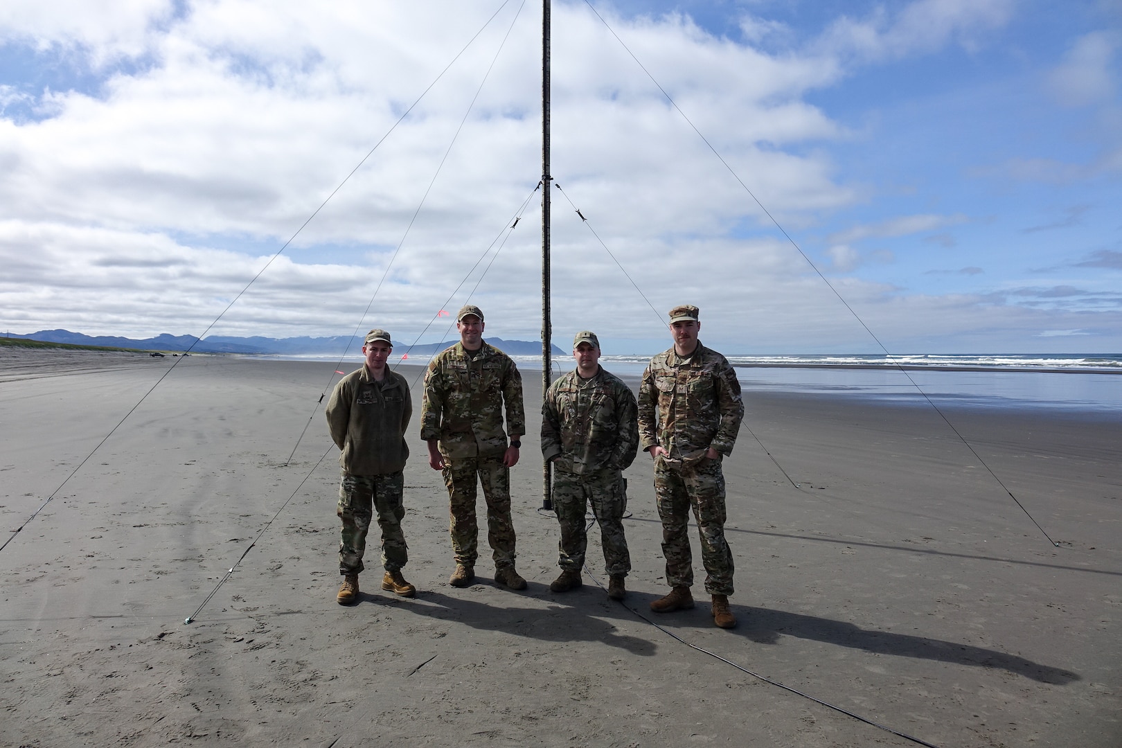 Setting up communication equipment on an Oregon beach