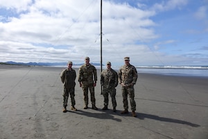 Setting up communication equipment on an Oregon beach