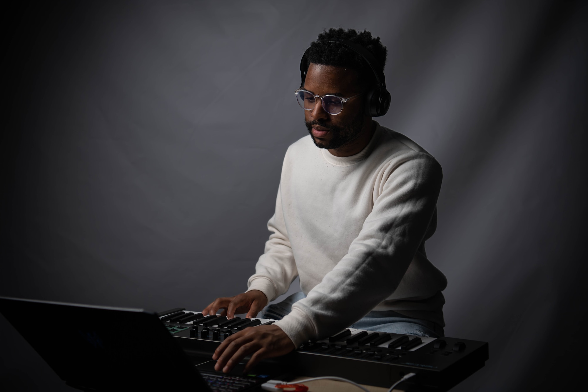 U.S. Air Force Airman Matthew Louis, 86th Logistics Readiness Squadron inventory apprentice, plays the piano at Ramstein Air Base, Germany, April 21, 2023. Louis has been making a form of music called electronic dance music since the age of 15 and sold his first song when he was 17-years-old for $30,000. (U.S. Air Force photo by Airman 1st Class Jared Lovett)