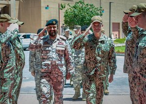 MANAMA, Bahrain (May 2, 2023) Vice Adm. Brad Cooper, commander of U.S. Naval Forces Central Command, U.S. 5th Fleet and Combined Maritime Forces, and Commander of the Qatari Emiri Navy Maj. Gen. Abdullah Hassan Al-Sulaiti salute while entering U.S. 5th Fleet headquarters in Manama, Bahrain, May 2, 2023.