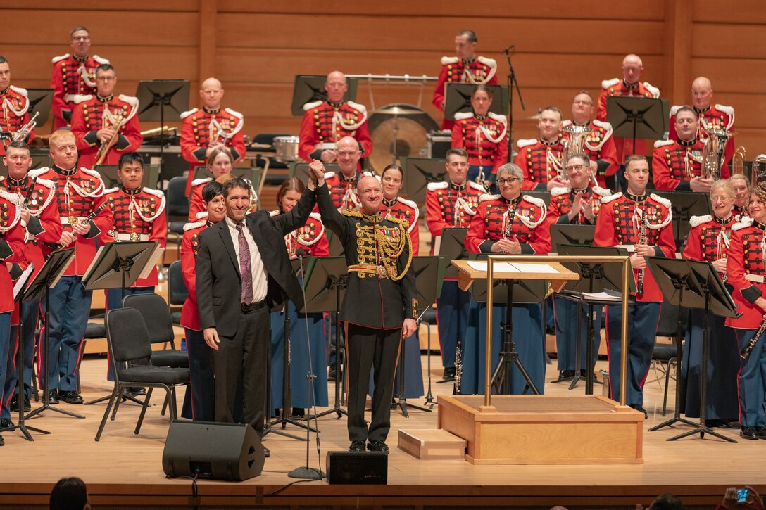 Col. Jason Fettig and composer Jonathan Leshnoff take the stage together for a bow after the world premiere of "Symphony for Winds," which was performed by the Marine Band during the ensemble's 225th anniversary concert held in North Bethesda, Md. on April 30, 2023.

(U.S. Marine Corps photos by SSgt. Chase Baran/Released)