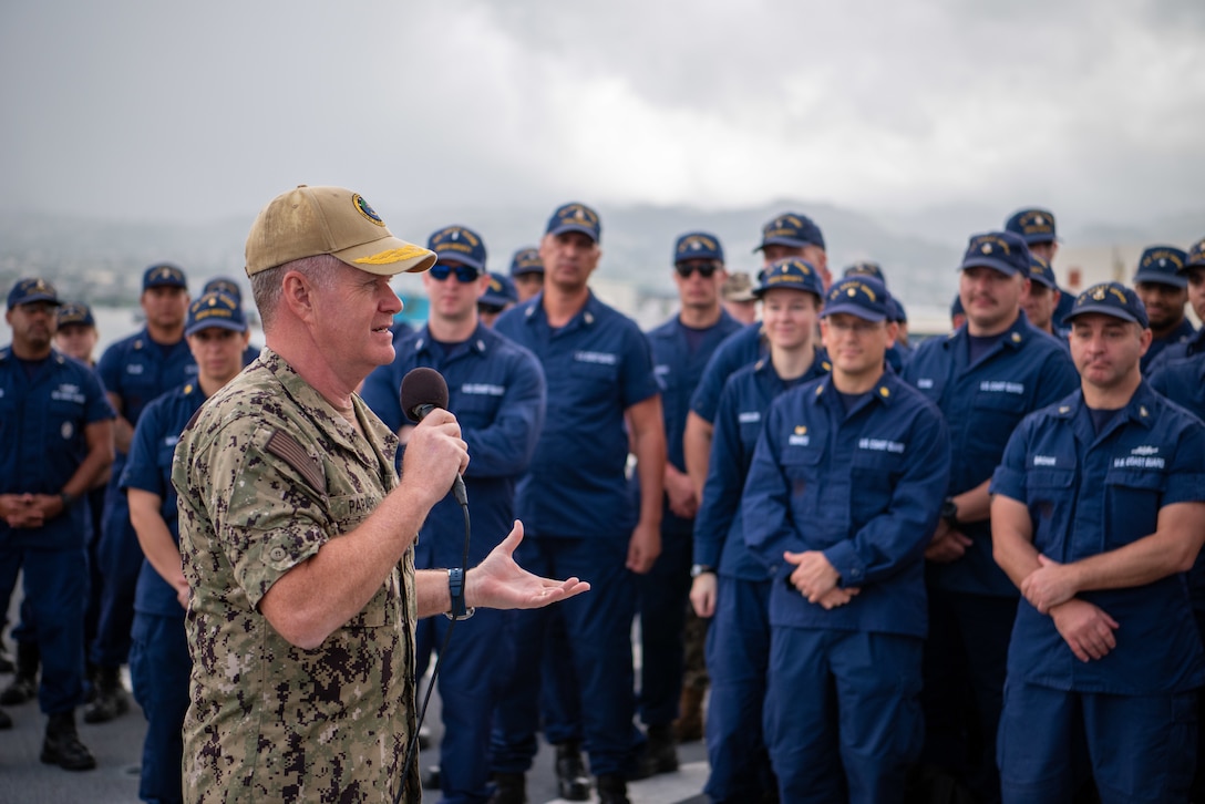 Adm. Samuel Paparo, commander, U.S. Pacific Fleet, meets with Ens. Logan Tobias, a deck watch officer assigned to U.S. Coast Guard Cutter Midgett (WMSL 757)