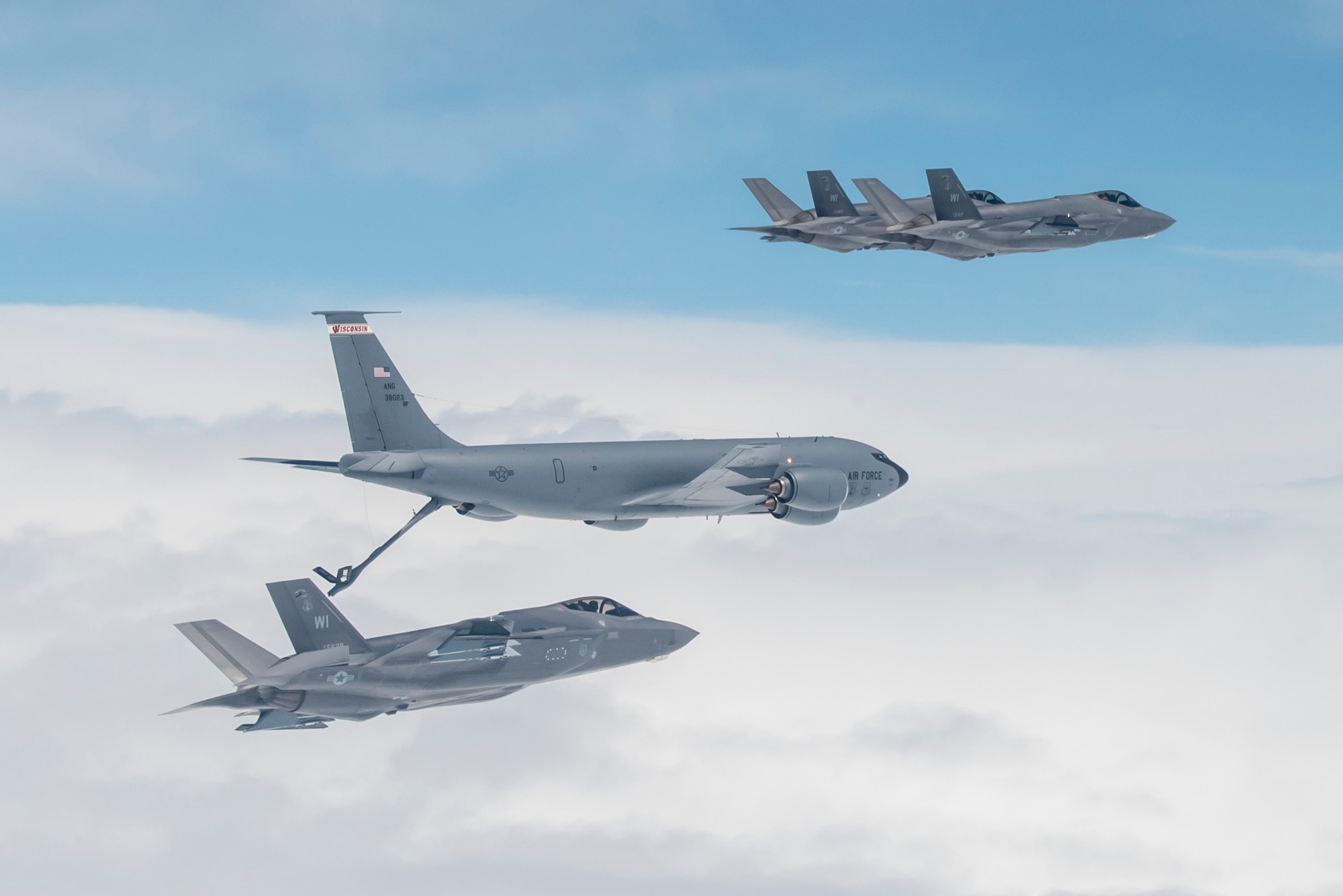 F-35 Lightning II aircraft assigned to the 115th Fighter Wing, Truax Field, Madison, Wisconsin receive fuel from a KC-135 Stratotanker assigned to the 128th Air Refueling Wing in Milwaukee during their initial flight to Truax Field April 25, 2023.