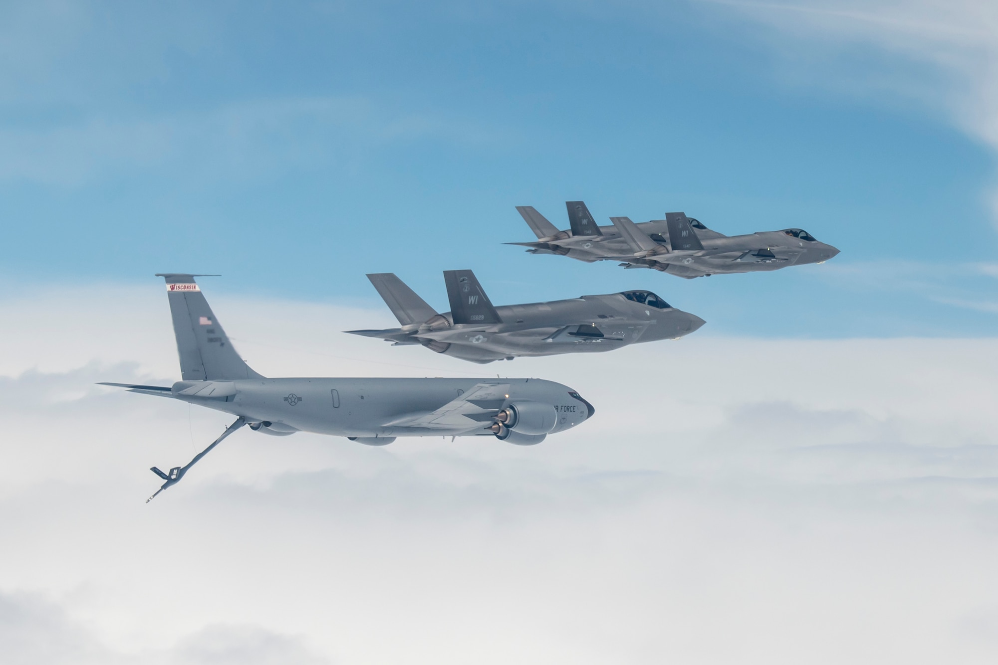 F-35 Lightning II aircraft assigned to the 115th Fighter Wing, Truax Field, Madison, Wisconsin receive fuel from a KC-135 Stratotanker assigned to the 128th Air Refueling Wing in Milwaukee during their initial flight to Truax Field April 25, 2023.