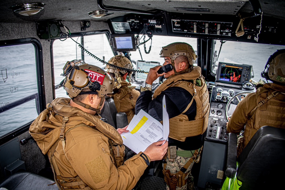 Sailors assigned to Maritime Expeditionary Security Squadron (MSRON) 11 conduct a maritime escort mission exercise with U.S. Coast Guard Port Security Unit 311