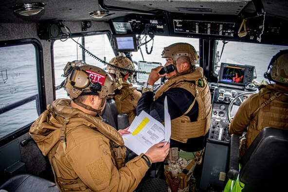 Sailors assigned to Maritime Expeditionary Security Squadron (MSRON) 11 conduct a maritime escort mission exercise with U.S. Coast Guard Port Security Unit 311